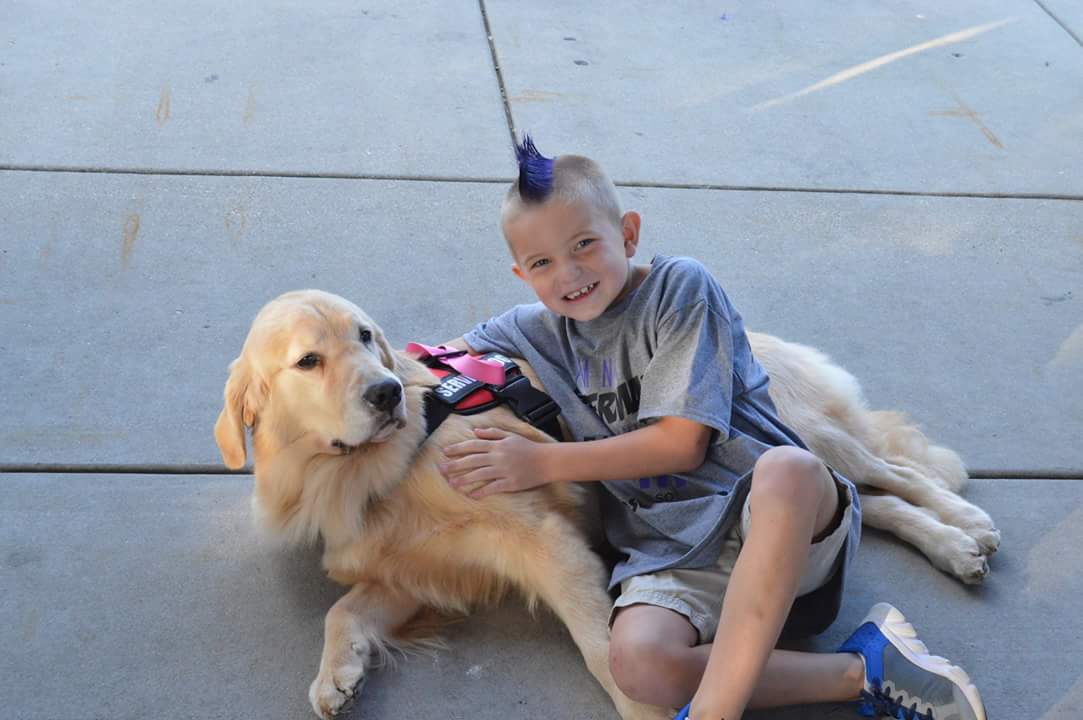 Cayden with a service dog