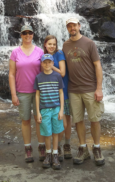 Jillian and family at a waterfall
